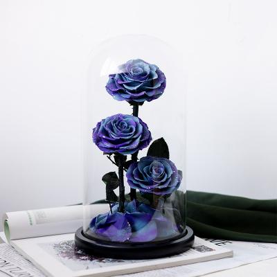 Three eternal roses in glass dome